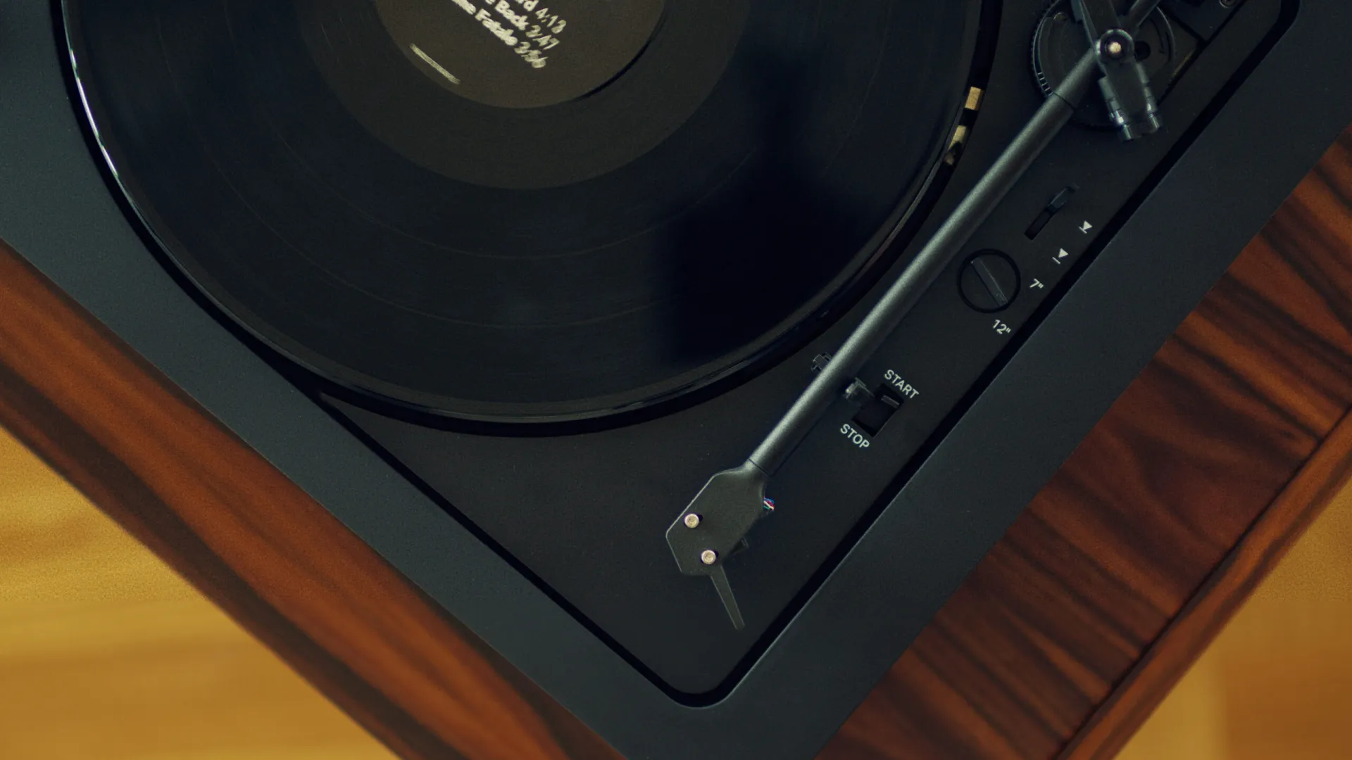 The Pro-Ject Automat A2 has "Start" and "Stop" controls for fully automatic play