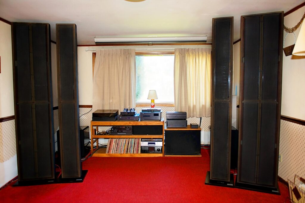 A pair of Acoustat 2+2 loudspeakers, flanking a pair of Acoustat 1+1 speakers