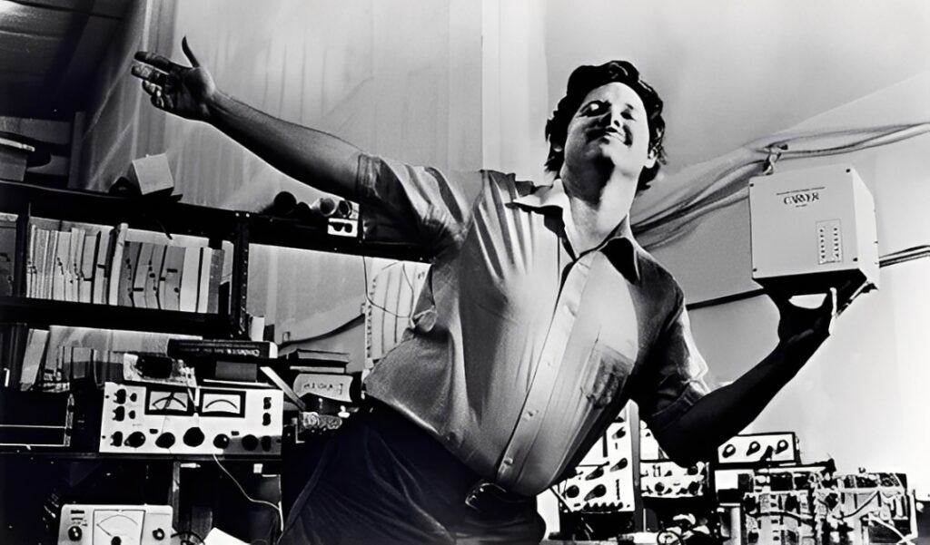 Bob Carver dancing to demonstrate the compact size and light weight of the M-400