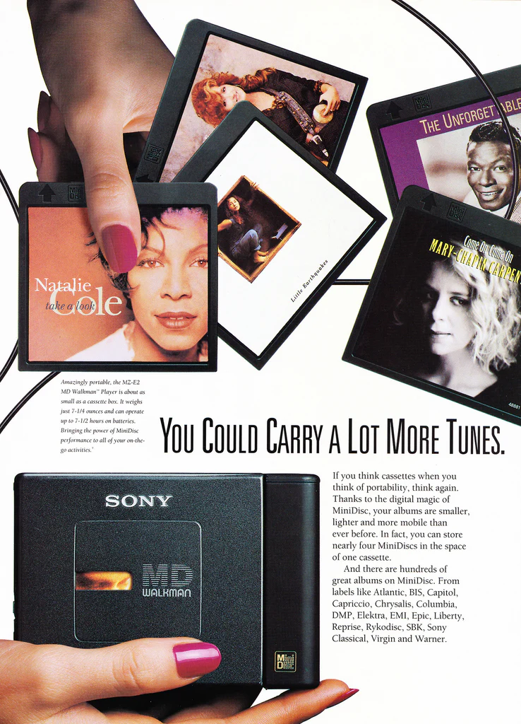 Print advertisement from Sony showing the player and a collection of prerecorded MiniDiscs from various labels