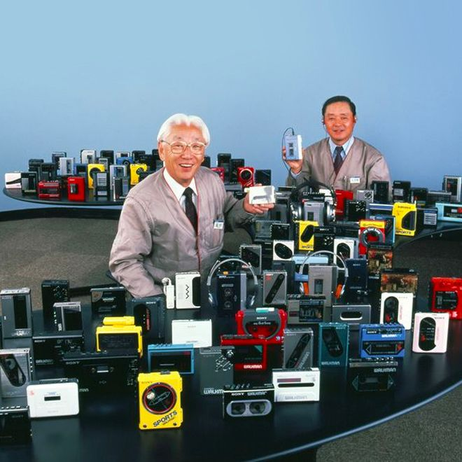 Akio Morita surrounded by a few (!) of his Sony portable music players