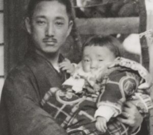 Akio Morita, age 4 months and his father